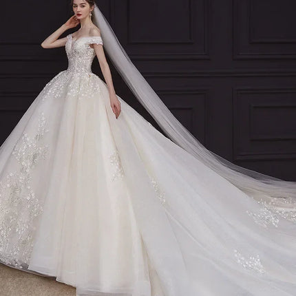 Luxury Off-Shoulder Wedding Dress - Handmade Lace Ball Gown | Femstylo