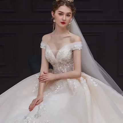 Luxury Off-Shoulder Wedding Dress - Handmade Lace Ball Gown | Femstylo