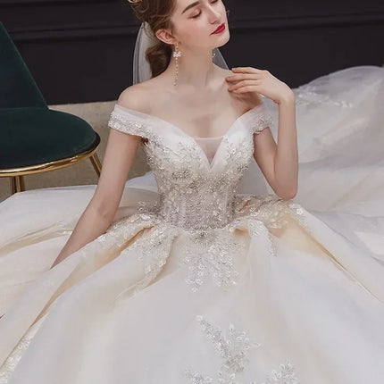 Luxury Off-Shoulder Wedding Dress - Handmade Lace Ball Gown | Femstylo