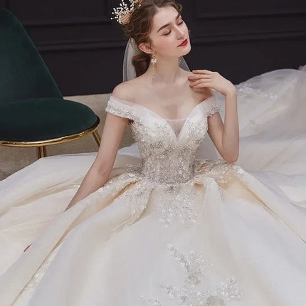Luxury Off-Shoulder Wedding Dress - Handmade Lace Ball Gown | Femstylo