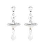 Silver Saturn earrings / 18K