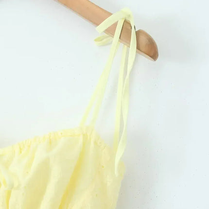 YENKYE Sexy Elegant Women Hollow Out Embroidery Yellow Sling Mini Dress Low Waist Lace Up Bandage Party Dresses Birthday Robe