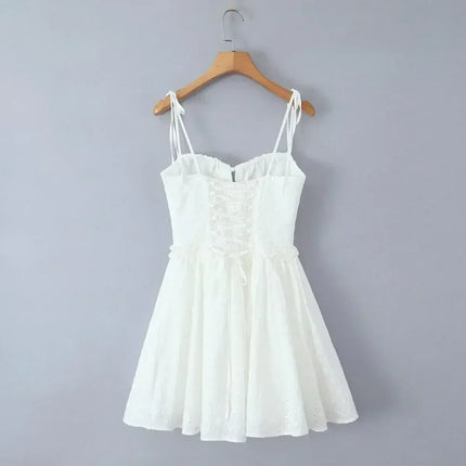 YENKYE Sexy Elegant Women Hollow Out Embroidery Yellow Sling Mini Dress Low Waist Lace Up Bandage Party Dresses Birthday Robe