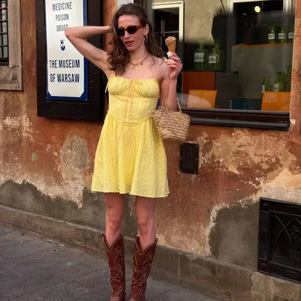 YENKYE Sexy Elegant Women Hollow Out Embroidery Yellow Sling Mini Dress Low Waist Lace Up Bandage Party Dresses Birthday Robe